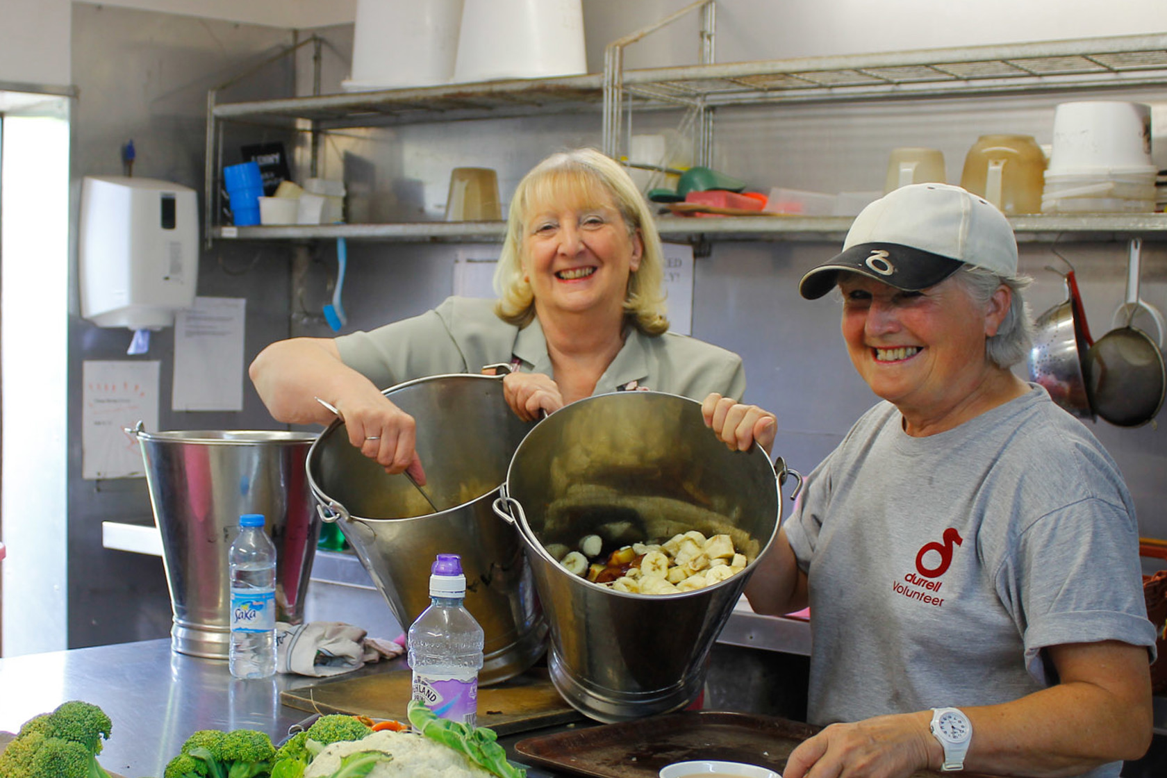 Volunteers chop food for the animals at Jersey Zoo